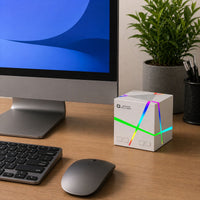 Ancha Cube speaker — lifestyle shot in dark room with RGB on