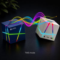 Ancha Cube speaker — compact size shown in hand for scale