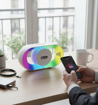 Swiss Military Audio UREE 10W Bluetooth speaker with RGB lights and TWS mode. White speaker with colorful LED accents.