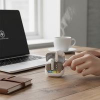 Swiss Military Audio white wireless earbuds with chrome accents and a charging case featuring a rainbow LED indicator.