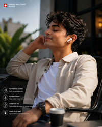 Swiss Military Audio white wireless earbuds with touch and voice control, worn by a man enjoying music outdoors.