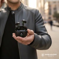 Swiss Military Audio Zeus black wireless earbuds with charging case. Features green indicator lights and touch controls.